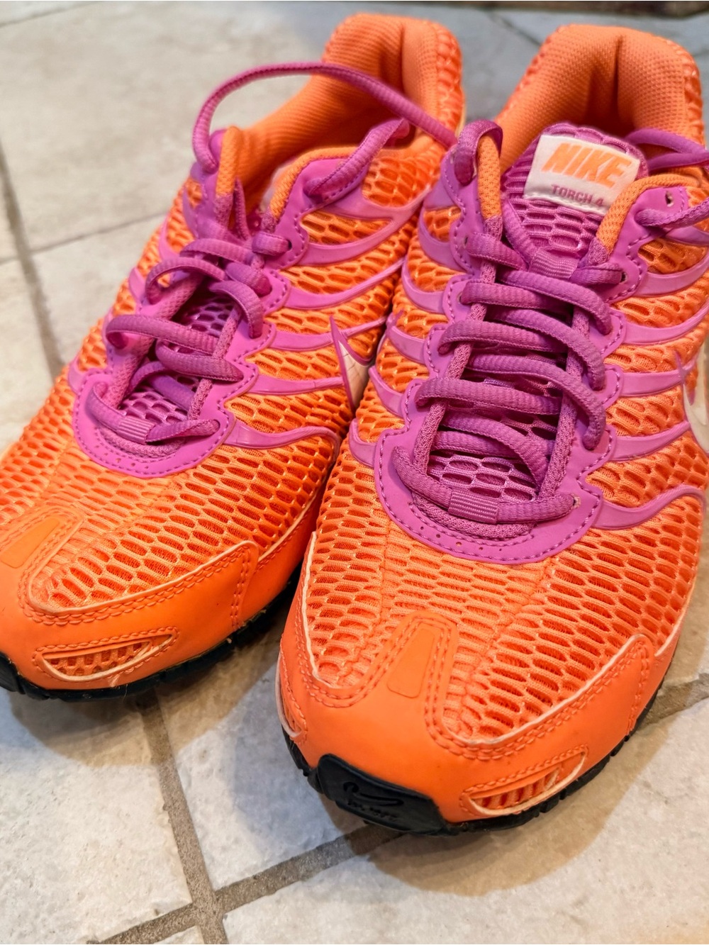 Nike women’s Orange and Pink Lightweight Mesh Sneakers